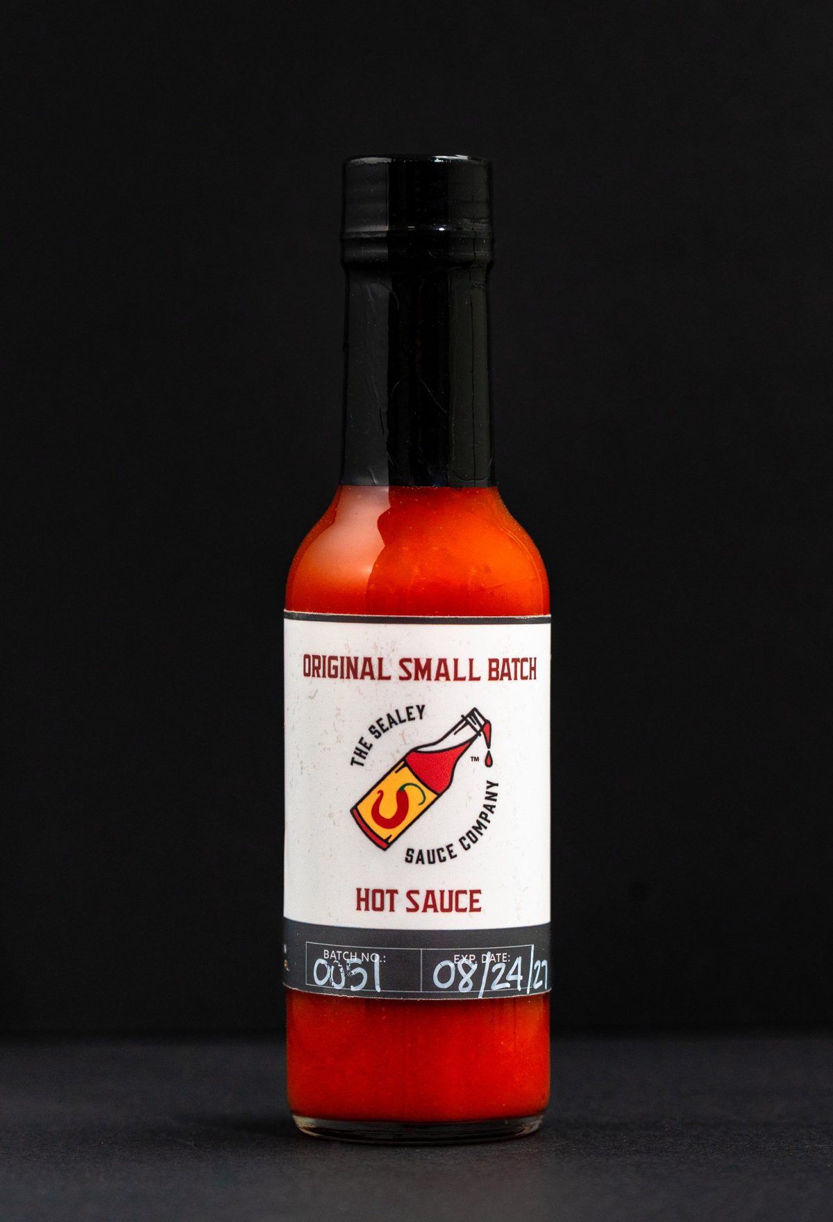 The Sealey Sauce Company Original Small Batch hot sauce on black — photo by Jimmy Warr