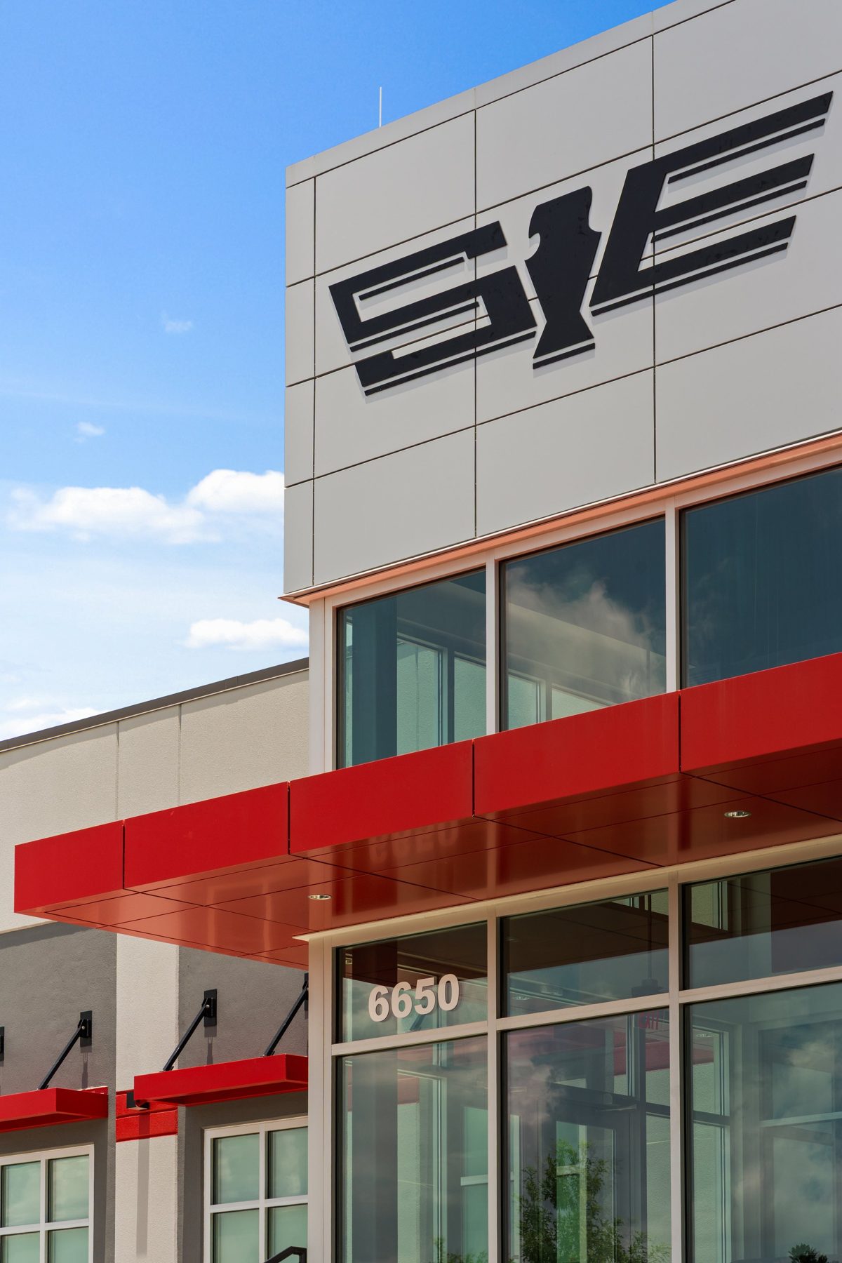 The SEFL logo above a red canopy and glass storefront — photo by Jimmy Warr