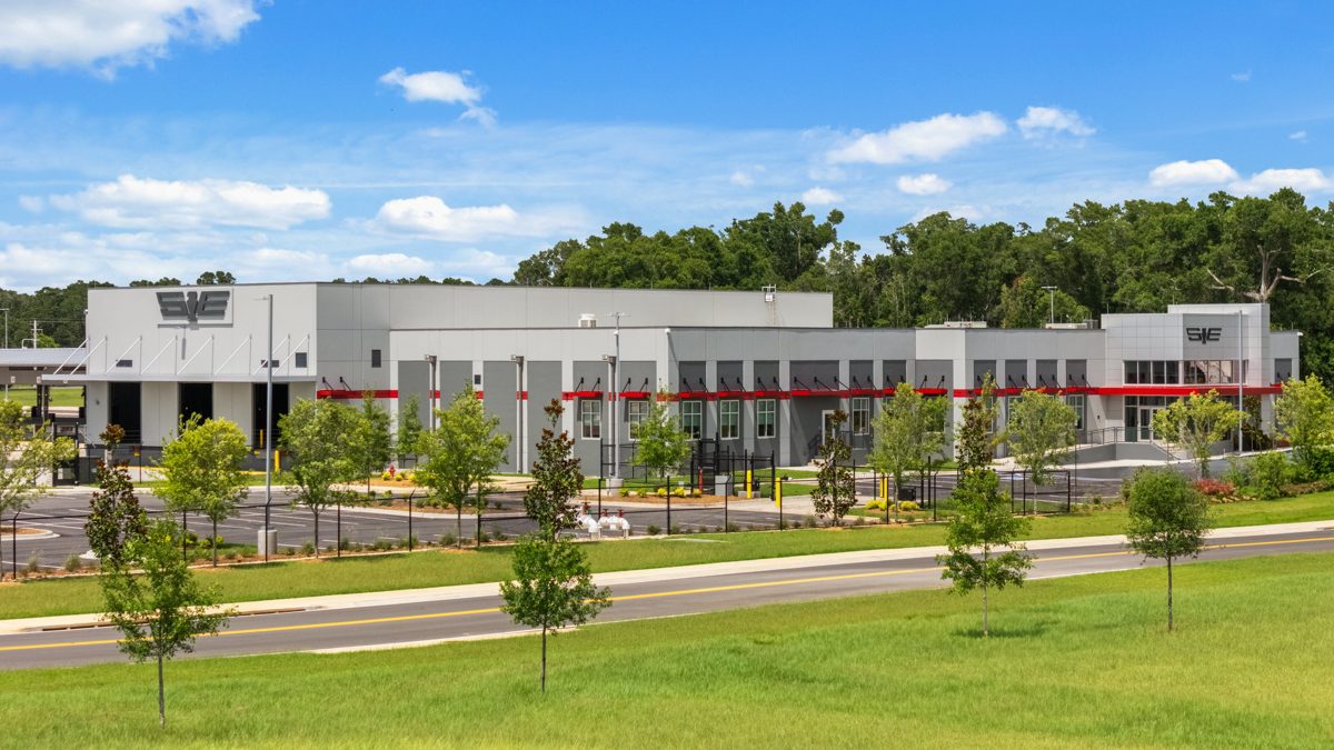 Southeastern Freight Lines facility seen from across the road, red accents running the length of its gray facade — photo by Jimmy Warr