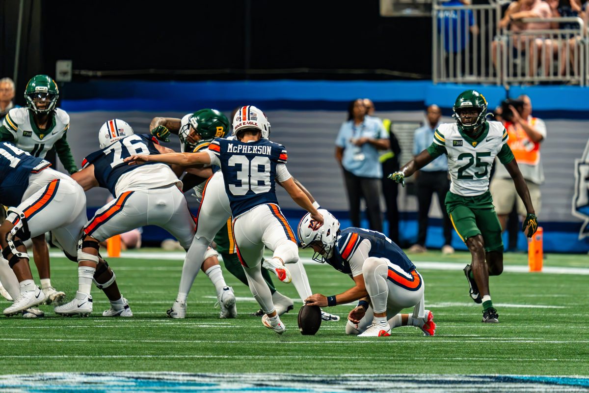Auburn kicker McPherson (#38) strikes a kick off the hold against Baylor — photo by Jimmy Warr