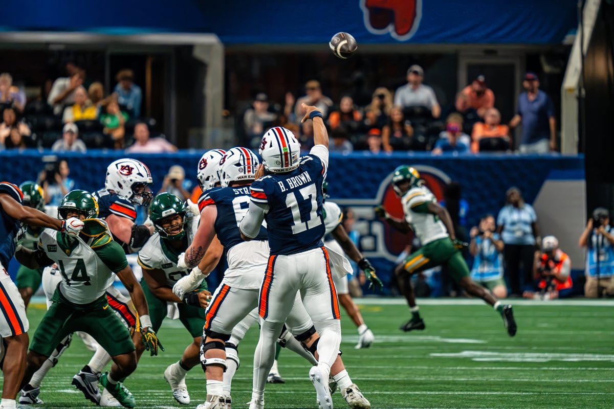 Auburn quarterback B. Brown (#17) releases a pass over the Baylor rush at the Aflac Kickoff Game — photo by Jimmy Warr