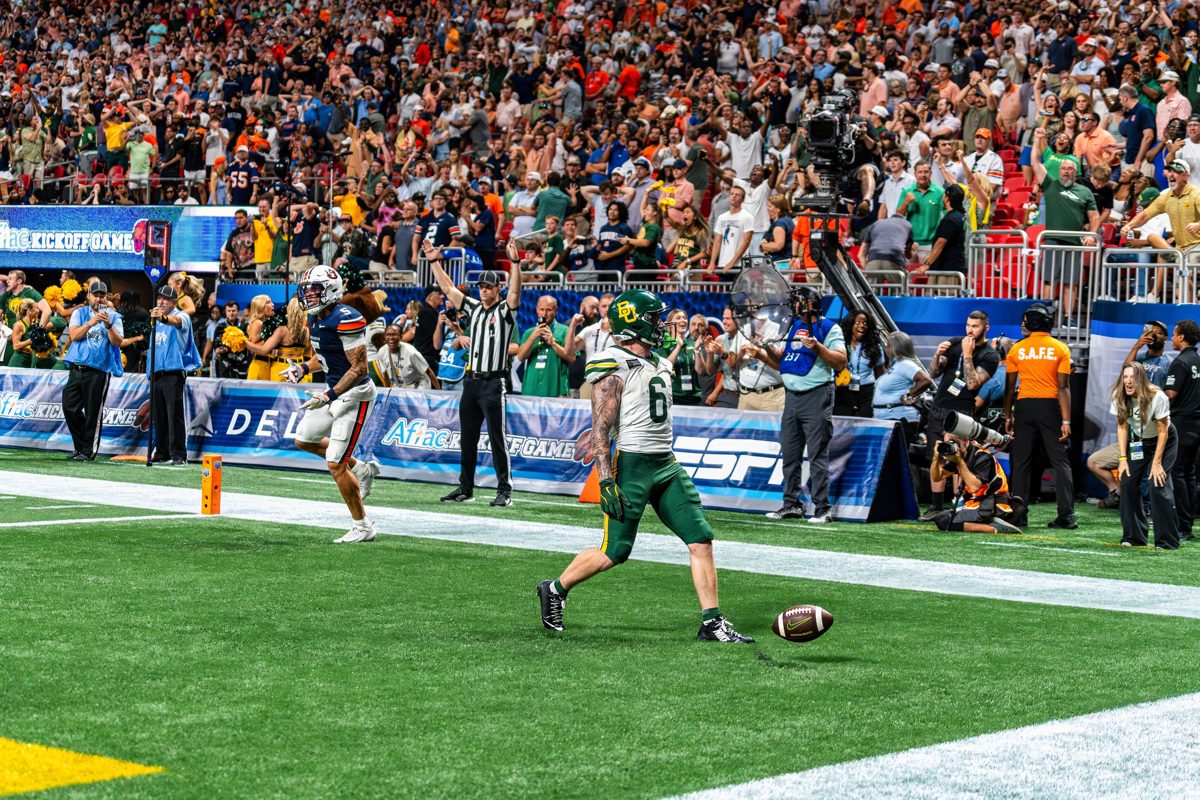 Baylor's #6 walks out of the end zone after a touchdown as the crowd reacts — photo by Jimmy Warr