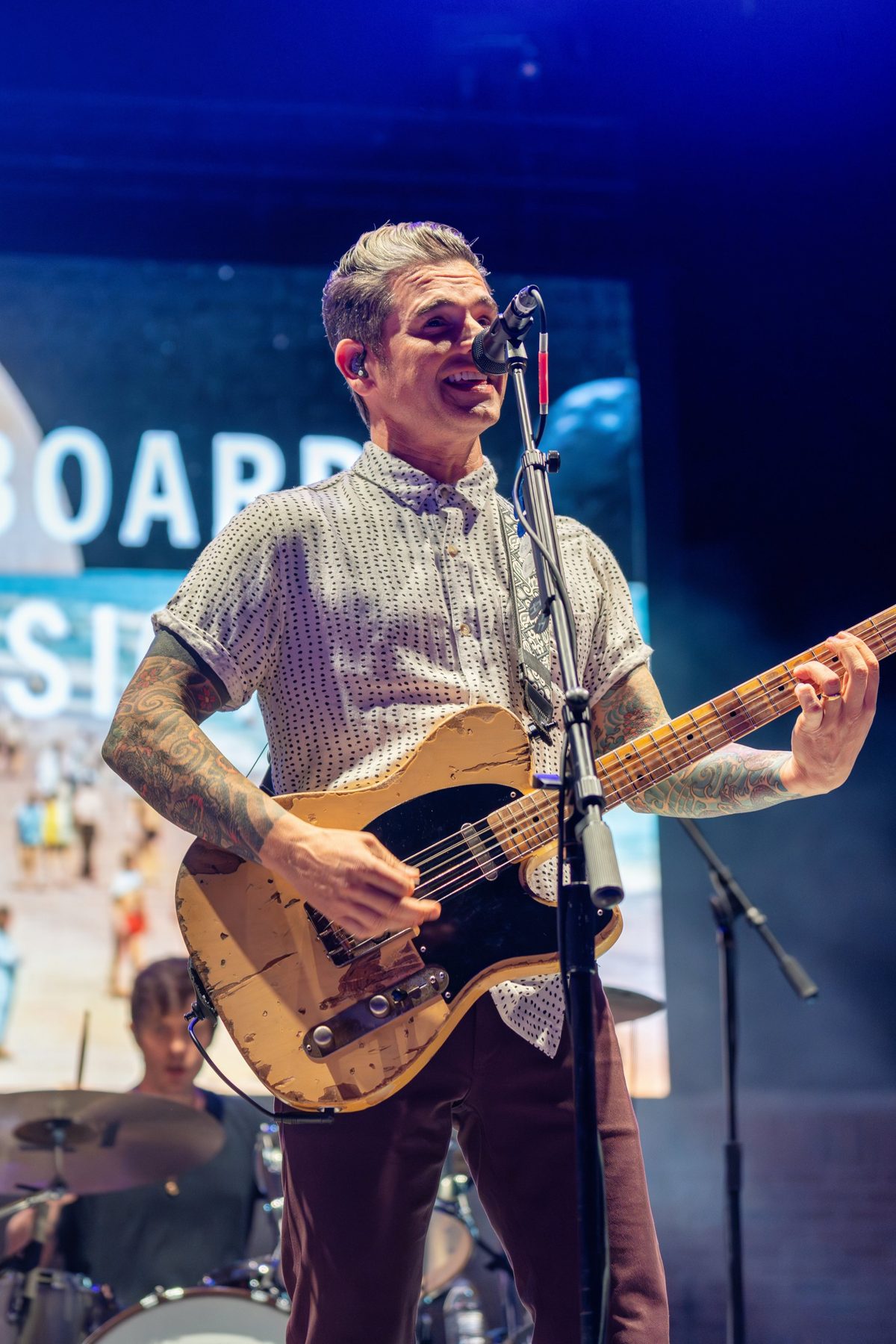 Dashboard Confessional frontman grins mid-song with a worn butterscotch Telecaster — photo by Jimmy Warr