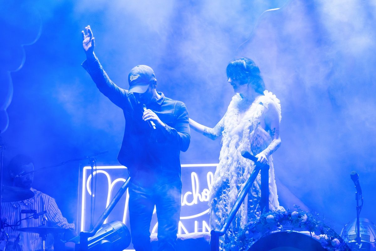 Dashboard Confessional and Japanese Breakfast share the stage in blue haze, one waving to the crowd — photo by Jimmy Warr